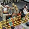 Police detain Congress workers and supporters at the party's Jan Akrosh Rally in Gandhinagar