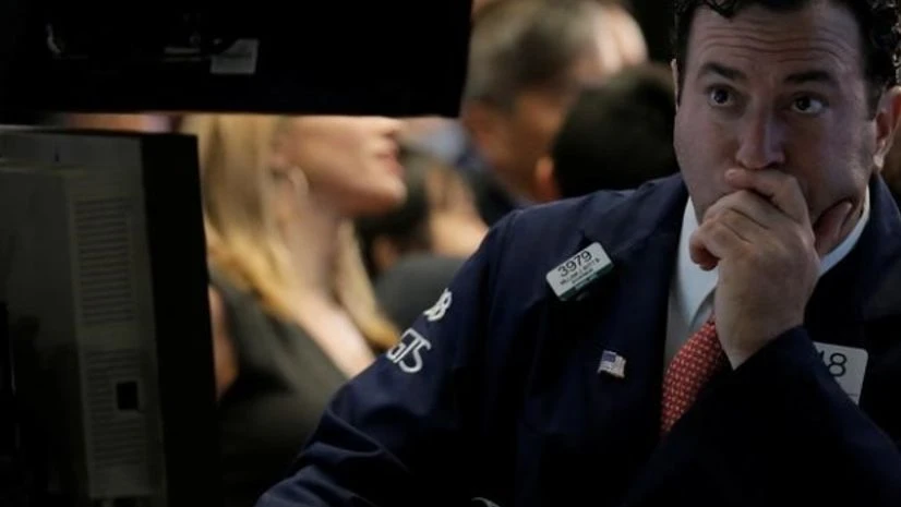 Traders work on the floor of the New York Stock Exchange (NYSE) in New York City, US Traders work on the floor of the New York Stock Exchange (NYSE) in New York City, US