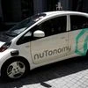 A nuTonomy self-driving taxi drives on the road in its public trial in Singapore