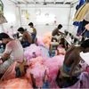 Employees work inside a garment factory in Mumbai