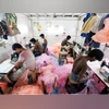 Employees work inside a garment factory in Mumbai