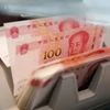 China's top banking regulator says yuan bears will suffer 'heavy losses'