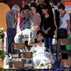 Relatives mourn over a coffin of one of the earthquake victims prior to the start of the funeral service in Ascoli Piceno, Italy.