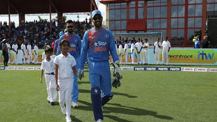 India's MS Dhoni leads his team onto the field before the first Twenty20 international cricket match against the West Indies India's MS Dhoni leads his team onto the field before the first Twenty20 international cricket match against the West Indies