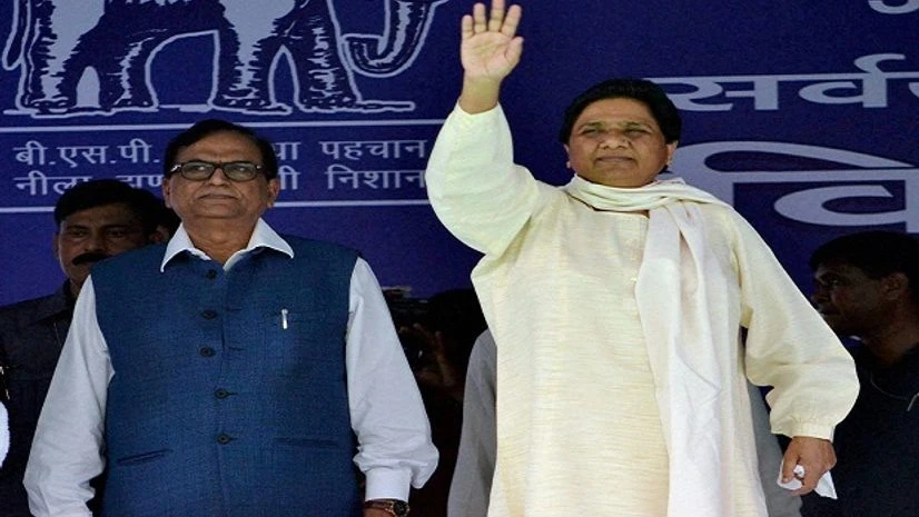 BSP chief Mayawati waves at the crowd during a mega rally in Azamgarh on Sunday. PTI Photo BSP chief Mayawati waves at the crowd during a mega rally in Azamgarh on Sunday. PTI Photo