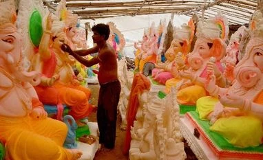 Dismal festive season for artisans due to 70% cut in post-Covid demand An artist giving touches to an idol of Lord Ganesh ahead of Ganesh festival