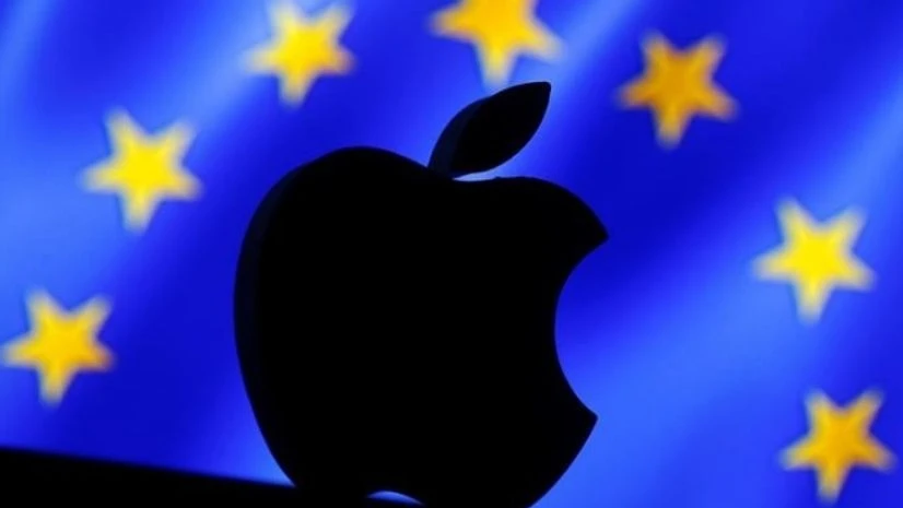 A 3D printed Apple logo is seen in front of a displayed European Union flag A 3D printed Apple logo is seen in front of a displayed European Union flag