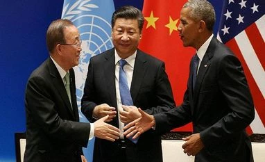 'No turning back,' says head of UN climate talks US President Barack Obama, right, and UN Secretary-General Ban Ki-moon shake hands in front of Chinese President Xi Jinping during a joint ratification of the Paris climate change agreement at the West Lake State Guest House in Hangzhou, China.