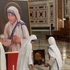Nuns of Mother Teresa's Missionaries of Charity, carry some of her relics during a vigil of prayer in preparation for the canonization of Mother Teresa in the St. John in Latheran Basilica at the Vatican.