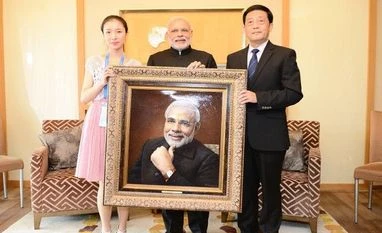 PM Modi gifted Chinese translations of ancient Indian texts Hand-painted oil painting of Narendra Modi (Photo: Vikas Swarup's Twitter Handle)