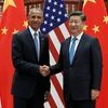 US President Barack Obama, left, and Chinese President Xi Jinping pose for photographers as they shake hands before a bilateral meeting at Westlake State House in Hangzhou in eastern China's Zhejiang province.