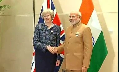 PM Modi meets UK's new PM Theresa May PM Narendra Modi meets the Prime Minister of the UK Theresa May in Hangzhou, China