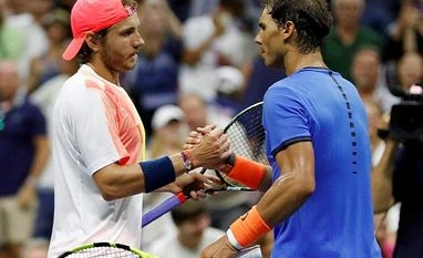 Lucas Pouille ousted Rafael Nadal to reach US Open quarters Lucas Pouille of France shakes hands with Rafael Nadal of Spain after winning their match during the fourth round of the US Open Tennis tournament in New York.