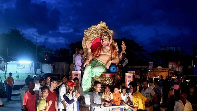 An artist decorates a Ganesha Idol with spices ahead of Ganesh festival in Mumbai. An artist decorates a Ganesha Idol with spices ahead of Ganesh festival in Mumbai.