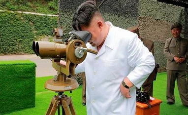 Test confirms nuclear warhead can be mounted on rockets: North Korea This undated photo distributed on Sept 6, 2016, by the North Korean govt shows North Korean leader Kim Jong-un looking though binoculars at the site of a ballistic missile launching at an undisclosed location in North Korea.