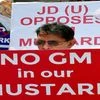 A supporter of Janata Dal (United)  protests against genetically modified mustard outside the Paryavaran Bhawan in New Delhi