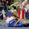 Kei Nishikori, of Japan, reacts after winning a point against Andy Murray, of the United Kingdom, during the quarter-finals of US Open