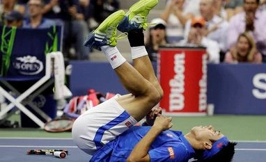 Kei Nishikori, of Japan, reacts after winning a point against Andy Murray, of the United Kingdom, during the quarter-finals of US Open Kei Nishikori, of Japan, reacts after winning a point against Andy Murray, of the United Kingdom, during the quarter-finals of US Open