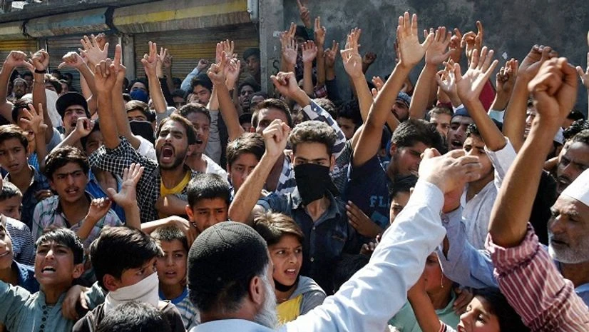 People shout slogans at a protest during the restrictions and strike in Srinagar People shout slogans at a protest during the restrictions and strike in Srinagar