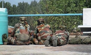 Poonch terror attack: Over 40 detained for questioning, search ops continue Security personnel take positions near the building where terrorists were hiding during the 3nd day of encounter at Allah Pir area in Poonch