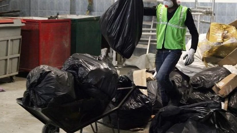 Workers from an environmentally-friendly rubbish disposal business called ScrapApp sort through garbage in a shopping mall in Noida Workers from an environmentally-friendly rubbish disposal business called ScrapApp sort through garbage in a shopping mall in Noida