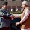 Prime Minister Narendra Modi greets Nepalese counterpart Pushpa Kamal Dahal during a ceremonial reception at Rashtrapati Bhavan in New Delhi