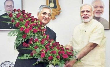 CJI laments lack of judges, pendency in his farewell speech Prime Minister Narendra Modi being greeted by Chief Justice of India T S Thakur on his birthday in Gandhinagar on Saturday | Photo: PTI