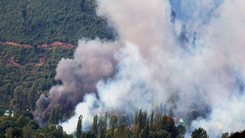Smoke rises from the Army Brigade camp during a terror attack in Uri, Jammu and Kashmir. Photo: PTI Smoke rises from the Army Brigade camp during a terror attack in Uri, Jammu and Kashmir. Photo: PTI