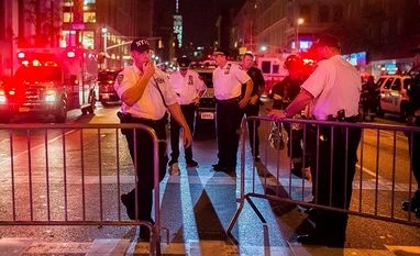 New York bombing suspect an Afghan-born US citizen Police work near the scene of an explosion in Manhattan's Chelsea neighborhood, in New York