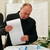 resident Vladimir Putin casts his ballot at a polling station during a parliamentary election in Moscow, Russia.