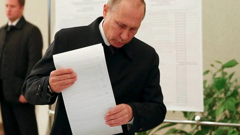 resident Vladimir Putin casts his ballot at a polling station during a parliamentary election in Moscow, Russia. resident Vladimir Putin casts his ballot at a polling station during a parliamentary election in Moscow, Russia.