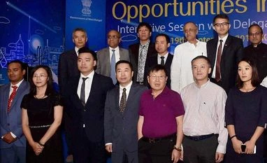 Chinese delegation in West Bengal to explore business opportunities West Bengal Finance and Industry Minister Amit Mitra and members of the Chinese delegation pose at an interactive meeting 'Opportunities in Bengal' in Kolkata. Photo: PTI