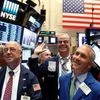 Traders react while working on the floor of the New York Stock Exchange (NYSE) in New York City