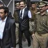 he Sahara group chairman Subrata Roy (C) is escorted by police to a court