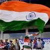 An Indian fan waving Tricolor flag in the gallery during 1st day of 2nd Test match between India and New Zealand at Eden Gardens in Kolkata.