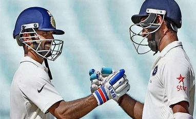 India end day one at 239 for 7 against Kiwis Indian batsman Cheteswar Pujara is greeted by Ajinkya Rahane (L) for his half century during 1st day of 2nd Test Match against New Zealand at Eden Garden in Kolkata. Photo:PTI