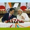 Japan's Prime Minister Shinzo Abe (L) and his Indian counterpart Narendra Modi shares a moment during a signing of agreement at Hyderabad House in New Delhi. (File Photo/Reuters)