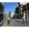 CRPF Jawans stand guard during the curfew and strike in Srinagar. (Photo: PTI)