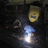 A worker welds at a Portuguese exporting factory in Pontinha, on the outskirts of Lisbon