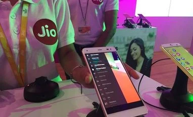 Reliance Jio files complaint with CCI against telcos A Reliance employee demonstrates Jio LYF phone at their headquarters on the outskirts of Mumbai