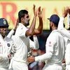 ndian bowler R Ashiwin with Cheteswar Pujara celebrates the wicket of New Zealand batsman Ross Taylor during the 4th day of the third test match in Indore. Photo: PTI