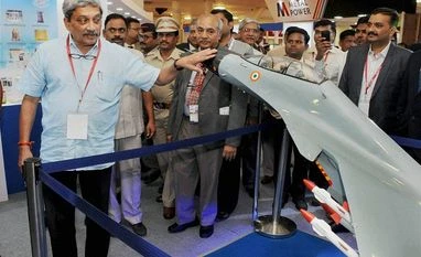 Don't mind sharing credit but major part goes to PM: Manohar Parrikar Union Defence Minister Manohar Parrikar looking at exhibits during the inauguration of METand HTS 2016 exibition in Vashi, New Mumbai. Photo: PTI