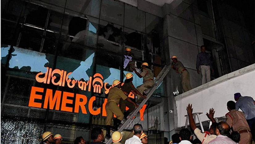 Rescue team in action at SUM Hospital where a fire broke out on Monaday night. (Photo: PTI) Rescue team in action at SUM Hospital where a fire broke out on Monaday night. (Photo: PTI)