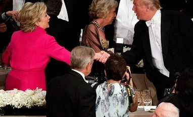 From immigration to Pakistan: Clinton and Trump's views on issues key to India's interests Republican presidential candidate Donald Trump, right, shakes hands with his Democratic counterpart Hillary Clinton during the Alfred E Smith Memorial Foundation dinner in New York. (Photo: AP/PTI)