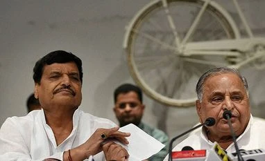 'Cycle' has become representative of power struggle, not development: BJP Samajwadi Party leader Shivpal Singh Yadav with party supremo Mulayam Singh Yadav. (Photo: PTI)
