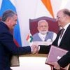 Igor Sechin (L), chief executive of Russia's top oil producer Rosneft, and Narendra Verma, managing director of ONGC Videsh Limited (OVL)