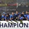 Indian cricket team celebrate with the winning trophy after victory over New Zealand by 190 runs at the 5th ODI match in Visakhapatnam.