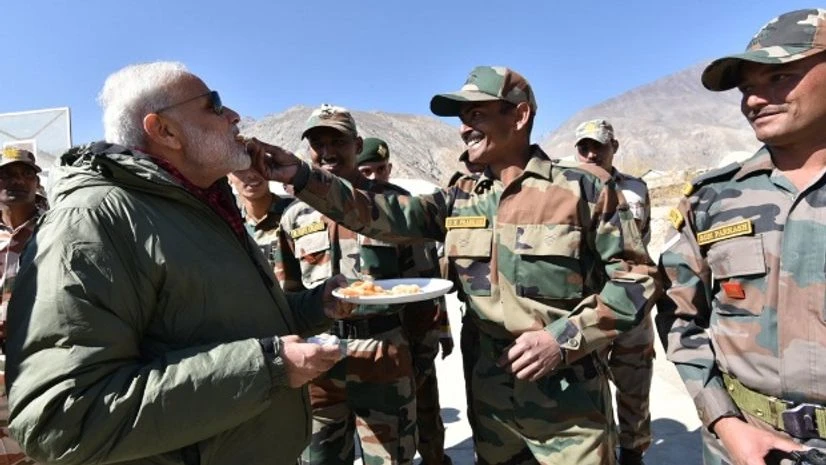 Jawans offer sweets to Prime Minister Narendra Modi on the occassion of Diwali at Sumdo in Himachal Pradesh. Photo: Narendra Modi Twitter Handle Jawans offer sweets to Prime Minister Narendra Modi on the occassion of Diwali at Sumdo in Himachal Pradesh. Photo: Narendra Modi Twitter Handle