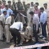 Police investigate the encounter site at the hillocks of Acharpura village after the STF killed 8 SIMI activists, who escaped from central jail after killing a security guard in Bhopal.