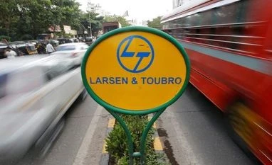 Derivative strategy on Larsen & Toubro by Chandan Taparia A sign of Larsen and Toubro (L&T) is placed on a road divider in Mumbai